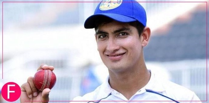 cricketer wearing blue cap